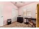 Comfortable bedroom with a closet, desk, and bright window, providing ample space for work or relaxation at 16274 N 138Th Ln, Surprise, AZ 85374