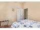 Cozy bedroom with neutral walls, closet, and a comfortable bed, creating a peaceful retreat at 16274 N 138Th Ln, Surprise, AZ 85374