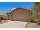 Charming exterior elevation featuring a spacious driveway and a well-maintained facade, showcasing curb appeal at 16274 N 138Th Ln, Surprise, AZ 85374