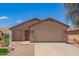 Charming single-story home featuring a neutral color scheme, well-maintained landscaping, and an attached two-car garage at 16274 N 138Th Ln, Surprise, AZ 85374