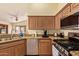 Updated kitchen features stainless steel appliances, granite countertops, and a breakfast bar at 16274 N 138Th Ln, Surprise, AZ 85374
