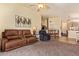 Open-concept living area featuring comfortable seating and easy access to the kitchen and dining areas at 16274 N 138Th Ln, Surprise, AZ 85374