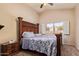 Spacious main bedroom features a large window providing natural light and a ceiling fan for comfort at 16274 N 138Th Ln, Surprise, AZ 85374