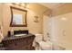 Well-maintained bathroom with a vanity, toilet, and a shower-tub combination at 17244 W Mohave St, Goodyear, AZ 85338