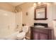 The bathroom has a vanity with a dark countertop, a toilet, and a shower-tub combination at 17244 W Mohave St, Goodyear, AZ 85338