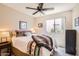 Inviting bedroom with a comfortable bed, side tables, and a scenic window view at 17244 W Mohave St, Goodyear, AZ 85338