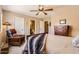 Spacious bedroom featuring a comfortable bed, dresser, and a cozy armchair at 17244 W Mohave St, Goodyear, AZ 85338