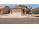 Charming single-level home featuring a two-car garage and desert landscaping at 17244 W Mohave St, Goodyear, AZ 85338