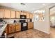 Charming kitchen featuring wooden cabinets, granite countertops, and an adjoining breakfast nook at 17244 W Mohave St, Goodyear, AZ 85338