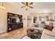 Open-concept living room with tile flooring and a view into the dining area at 17244 W Mohave St, Goodyear, AZ 85338