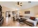 Spacious living room featuring tile floors and an open layout to the kitchen at 17244 W Mohave St, Goodyear, AZ 85338