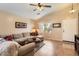 Comfortable living room with a vaulted ceiling, tile flooring, and natural light at 17244 W Mohave St, Goodyear, AZ 85338