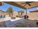 Relaxing covered patio area featuring an outdoor kitchen area, and a comfortable seating area at 17244 W Mohave St, Goodyear, AZ 85338