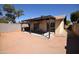 Large backyard featuring a covered patio area, ideal for outdoor relaxation and entertaining at 1905 E Inverness Ave, Mesa, AZ 85204