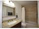 Updated bathroom with a granite countertop, framed mirror, a shower with tiled walls and a tub at 1905 E Inverness Ave, Mesa, AZ 85204