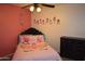 Charming bedroom with unicorn bedding, a ceiling fan, and a dark wood dresser at 1905 E Inverness Ave, Mesa, AZ 85204