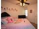 Cozy bedroom with ceiling fan and a large dresser, perfect for a restful retreat at 1905 E Inverness Ave, Mesa, AZ 85204