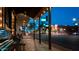 Inviting street view featuring illuminated sidewalks, benches, and nearby shops and restaurants at 1905 E Inverness Ave, Mesa, AZ 85204