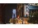 Night view of the lit Gilbert water tower behind a modern building with a tree at 1905 E Inverness Ave, Mesa, AZ 85204