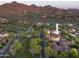 Expansive aerial view showcasing the luxurious community, desert landscape, and mountain backdrop at 19922 N 101St Pl, Scottsdale, AZ 85255