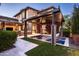 Relaxing backyard oasis with a spa, pergola, outdoor kitchen and lush landscaping at 19922 N 101St Pl, Scottsdale, AZ 85255