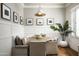 Inviting dining area with booth seating, modern light fixture and natural light, perfect for intimate meals and gatherings at 19922 N 101St Pl, Scottsdale, AZ 85255