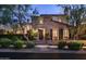 Charming brick home with meticulously landscaped front yard and inviting entrance at 19922 N 101St Pl, Scottsdale, AZ 85255