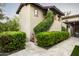 Charming home featuring lush greenery, a tile roof, and a well-manicured landscape at 19922 N 101St Pl, Scottsdale, AZ 85255