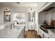 Gourmet kitchen featuring custom cabinetry, stainless steel appliances, and a center island at 19922 N 101St Pl, Scottsdale, AZ 85255