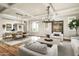 Bright living room featuring hardwood floors, modern decor, and ample seating at 19922 N 101St Pl, Scottsdale, AZ 85255