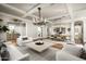 Open-concept living and dining room featuring hardwood floors, modern decor, and ample seating at 19922 N 101St Pl, Scottsdale, AZ 85255
