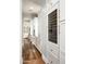 Hallway with white cabinets and a wine fridge at 19922 N 101St Pl, Scottsdale, AZ 85255
