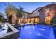 Inviting backyard featuring a sparkling pool, stone patio, and lush landscaping, perfect for outdoor entertaining at 19922 N 101St Pl, Scottsdale, AZ 85255