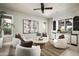 Comfortable sitting room with neutral tones, plush seating, and a bar area, perfect for relaxation and entertaining at 19922 N 101St Pl, Scottsdale, AZ 85255