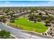 Aerial view of the neighborhood park and green space with mature trees at 20426 N Alma Dr, Maricopa, AZ 85138