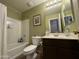 Bathroom featuring a shower-tub combo, vanity with sink, and tiled floor at 20426 N Alma Dr, Maricopa, AZ 85138