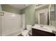 Bathroom featuring a shower-tub combo and modern fixtures, providing a functional and clean space at 20426 N Alma Dr, Maricopa, AZ 85138