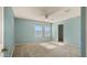 Well-lit bedroom with neutral carpet, ceiling fan, and windows, creating a comfortable and inviting space at 20426 N Alma Dr, Maricopa, AZ 85138