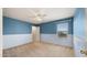 Bedroom with two-tone paint, neutral carpet, ceiling fan and natural light for a cozy, welcoming atmosphere at 20426 N Alma Dr, Maricopa, AZ 85138