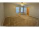 Bedroom featuring carpet, ceiling fan and two windows with blinds at 20426 N Alma Dr, Maricopa, AZ 85138