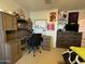 Functional bedroom designed with built-in study space, perfect for work, school or creative projects at 20426 N Alma Dr, Maricopa, AZ 85138