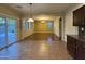 Bright dining room with an open layout, with views of the backyard swimming pool from the sliding glass doors at 20426 N Alma Dr, Maricopa, AZ 85138