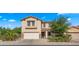 Charming two-story home featuring a two-car garage, well-manicured landscaping, and inviting curb appeal at 20426 N Alma Dr, Maricopa, AZ 85138