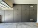 Organized garage area designed with custom storage units for optimal organization and decluttering at 20426 N Alma Dr, Maricopa, AZ 85138