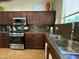 Well-equipped kitchen featuring stainless steel appliances and generous counter space for cooking at 20426 N Alma Dr, Maricopa, AZ 85138