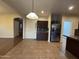 Spacious kitchen featuring a large island, stainless steel appliances, ample cabinet space, and open access to other living areas at 20426 N Alma Dr, Maricopa, AZ 85138