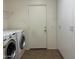 Convenient laundry area with washer, dryer, storage and easy access to other areas of the home at 20426 N Alma Dr, Maricopa, AZ 85138