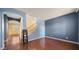 Inviting living room showcasing hardwood floors, neutral walls, and an staircase at 20426 N Alma Dr, Maricopa, AZ 85138
