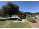 Relaxing picnic area offers shady spots under mature trees near the pool at 20426 N Alma Dr, Maricopa, AZ 85138
