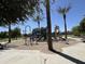 Community playground featuring modern equipment surrounded by lush landscaping and ample space for recreational fun at 20426 N Alma Dr, Maricopa, AZ 85138